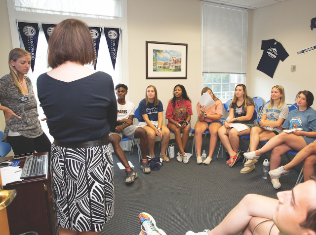 DR. EMILY HEADY with students